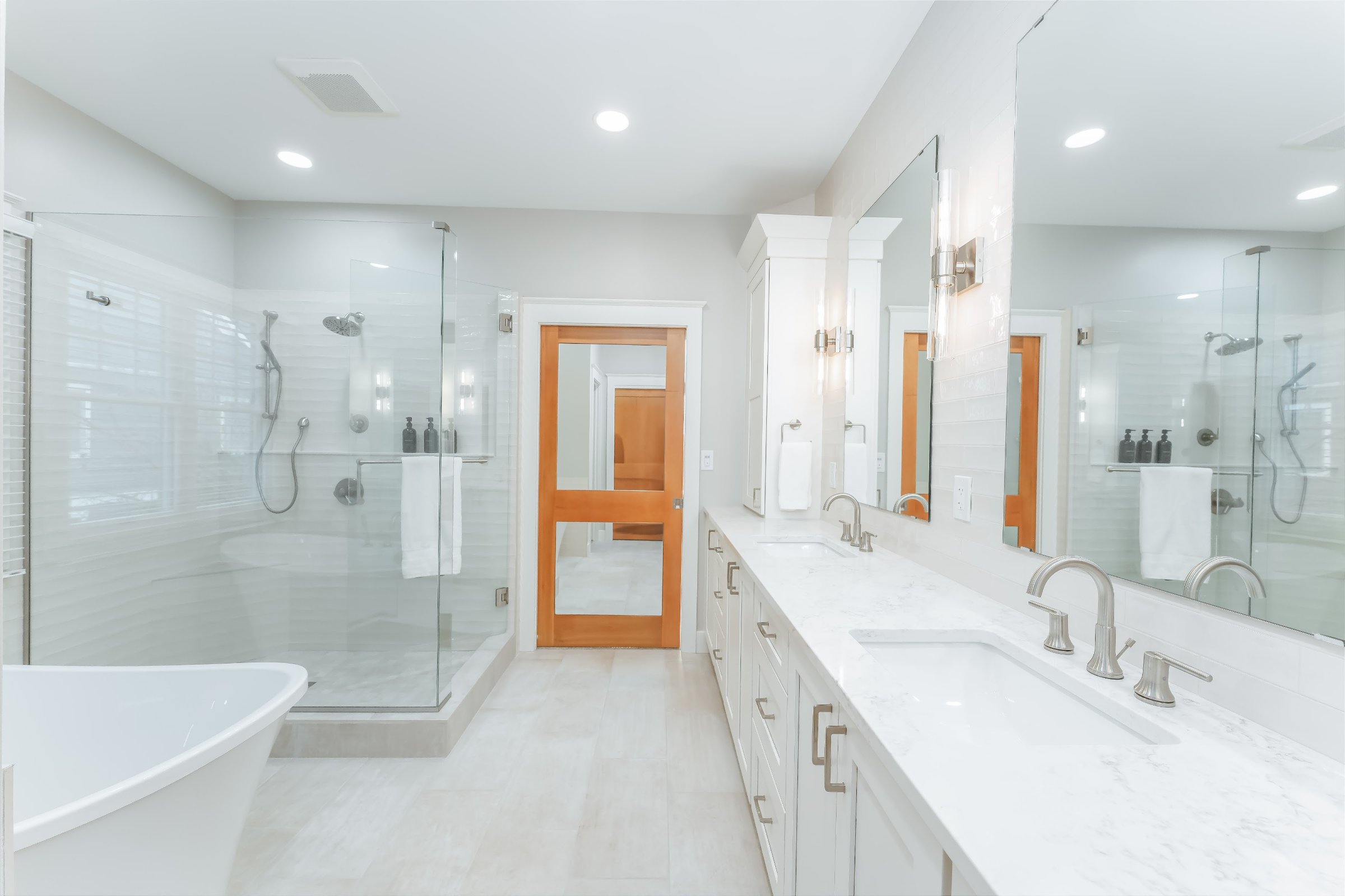 Luxury bathroom — frameless glass walk-in shower with marble tile
