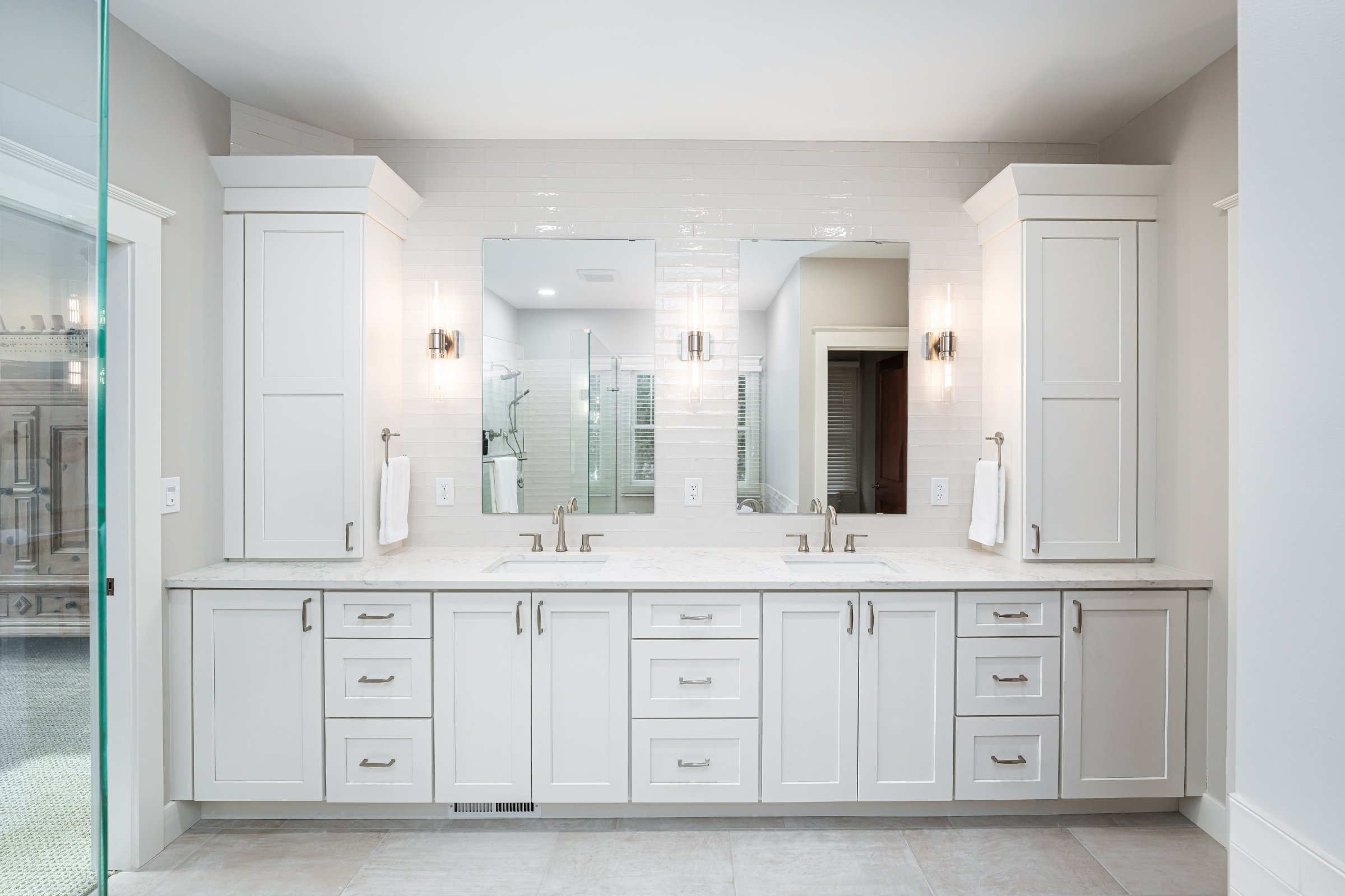 Luxury master bathroom remodel — freestanding soaking tub, marble tile shower, double vanity